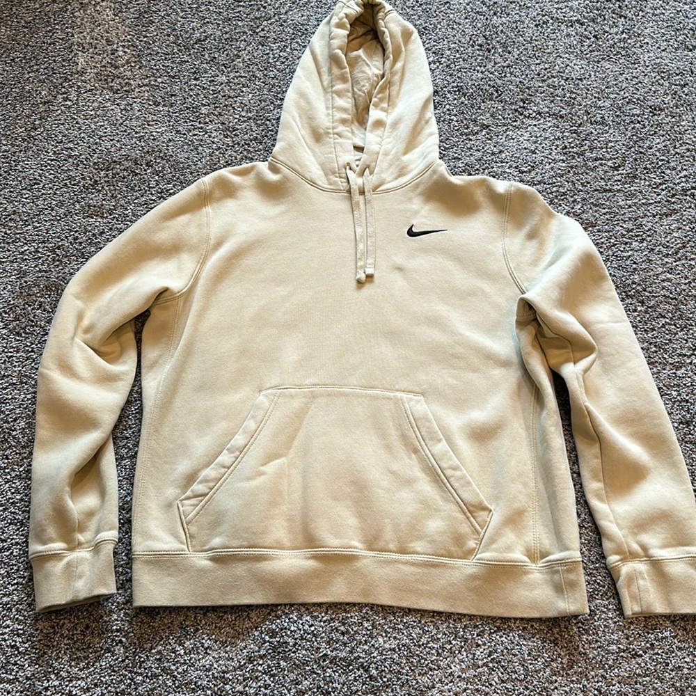 Nike tan sweatshirt with a black logo